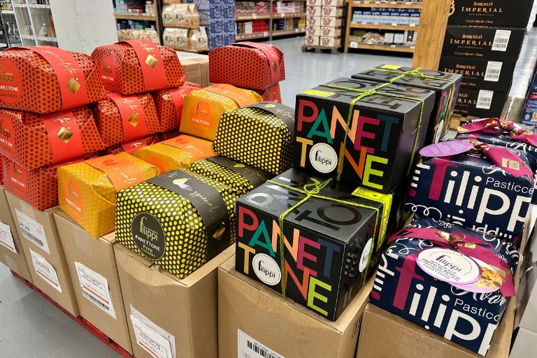 boxes of penettone on display in a store