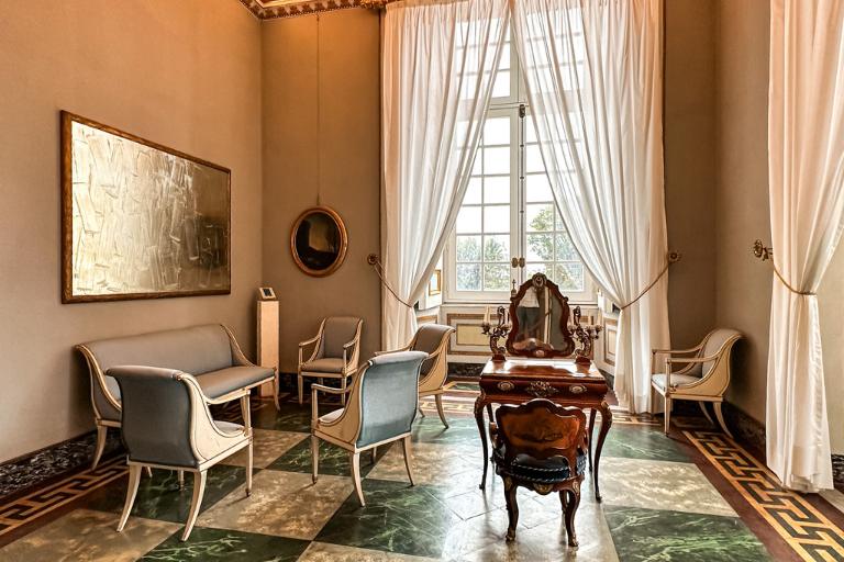 a room with a mirror and chairs