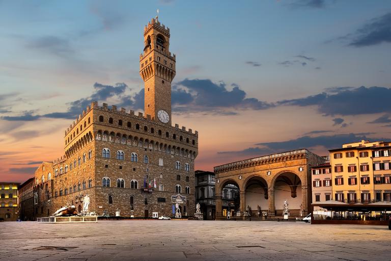 a large stone building with a clock tower