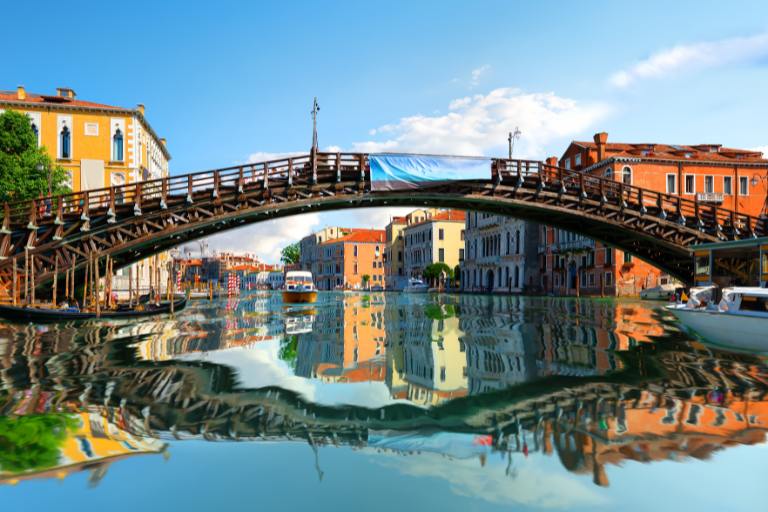 accademia bridge over water with buildings and boats