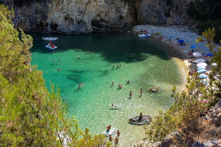 Discover 13 National Parks in Italy for Nature Lovers 8 shimmering water by a beach in Palinuro