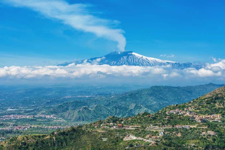 Discover 13 National Parks in Italy for Nature Lovers 21 View of the smoke coming out of the volcano in Mount Etna National Park